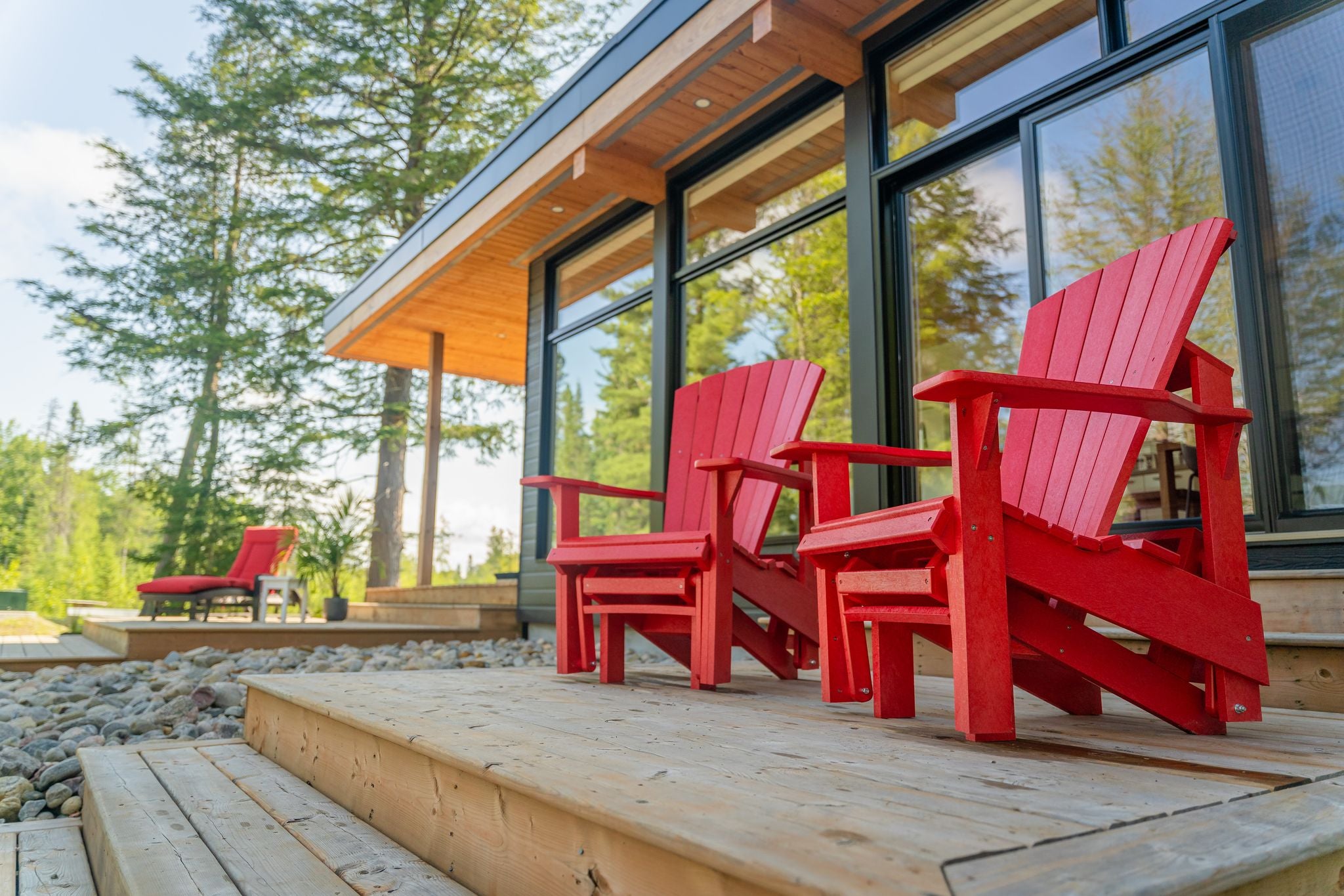 An image of two red patio chairs.